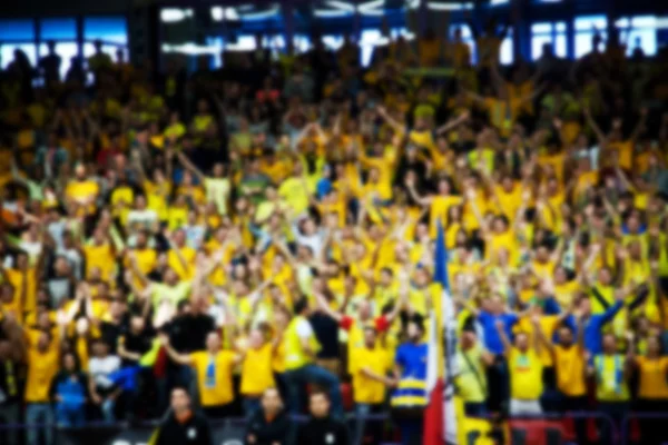 Blurred background of crowd of people in a basketball court — Stock Photo, Image