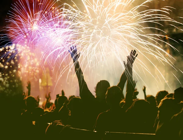 Cheering crowd and fireworks — Stock Photo, Image