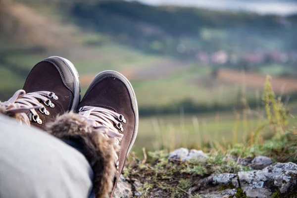 trekking boots on mountain top