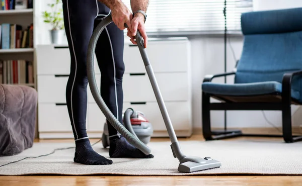 Man Vacuum Cleaning Home — Stock Photo, Image