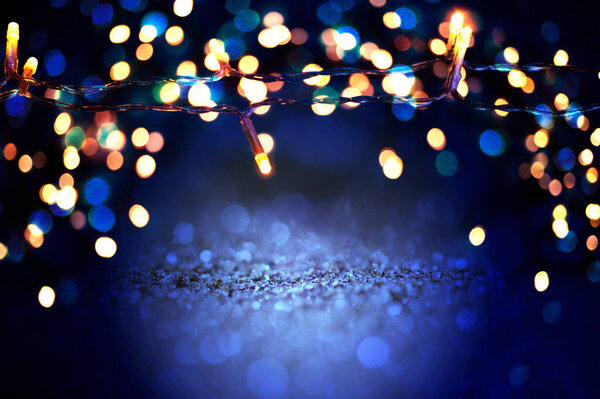 abstract blue glitter lights background defocused