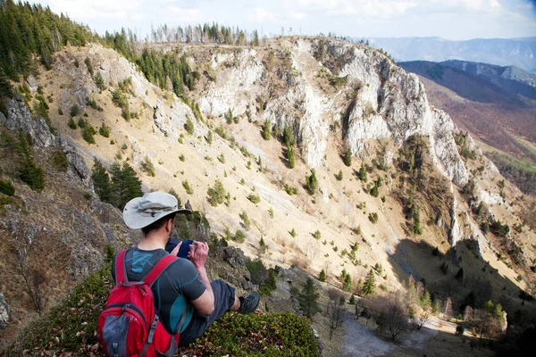 Male Hiker Sitting Top Mountain Admiring View Taking Pictures Smartphone — Stock Photo, Image