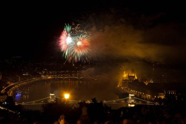 the 20th of August fireworks over Budapest Parliament, the Danube and chain bridge on St. Stephens or foundation day of Hungary clipart
