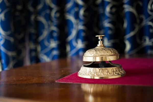 ring bell on reception desk in hotel