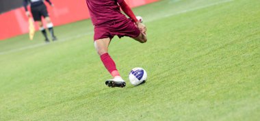 Futbol oyuncularının futbol için savaştığı pankart