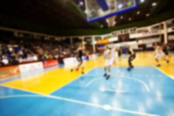 Blurred sports arena and fans during a basketball game