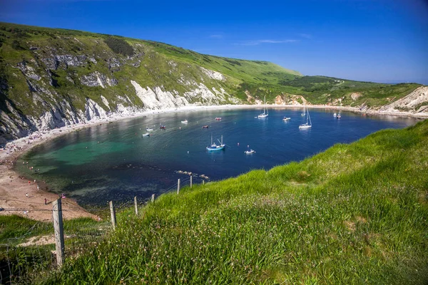 british seaside - summer holiday destination - Lulworth cove on Jurassic coast in southern Devon, UK