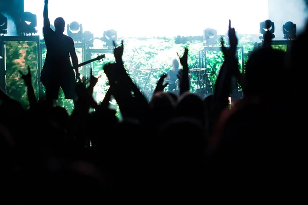 crowd with raised hands at concert - summer music festival