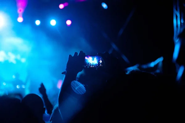 crowd with raised hands at concert - summer music festival