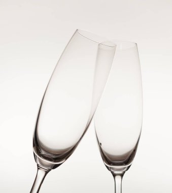empty Champagne glasses against light background 