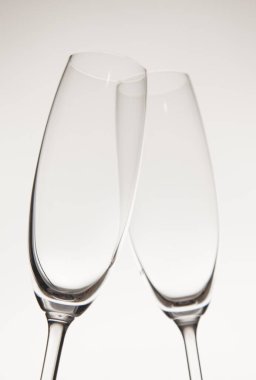empty Champagne glasses against light background 
