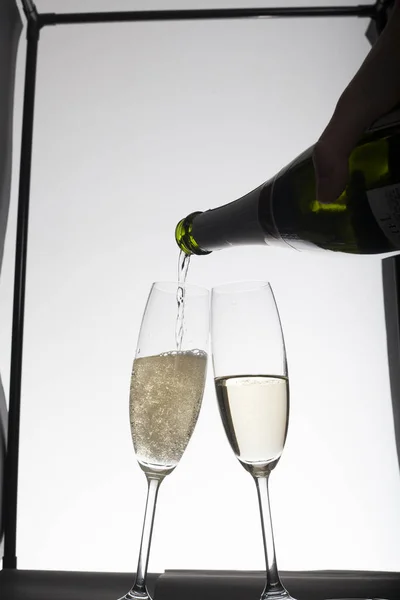 Pouring Champagne Glasses Light Background — Stock Photo, Image