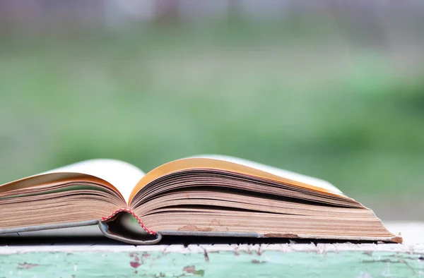 Closeup Book Green Blurred Background — Stock Photo, Image