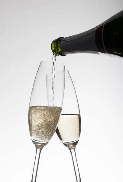 Pouring Champagne Glasses Light Background — Stock Photo, Image