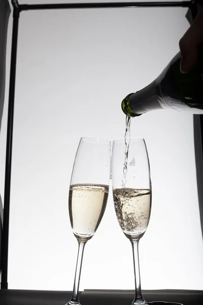 Pouring Champagne Glasses Light Background — Stock Photo, Image