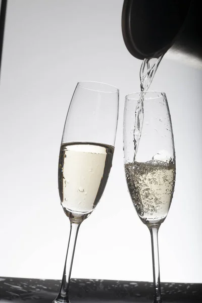 Pouring Champagne Glasses Light Background — Stock Photo, Image