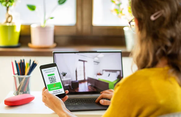 woman booking a hotel room after covid vaccination