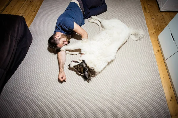 Man Floor Hugging His Dog — Stock Photo, Image