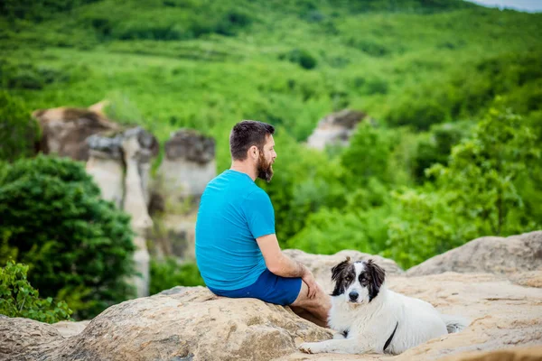 Man His Dog Sitting Rock Enjoying Nature — Stock Photo, Image
