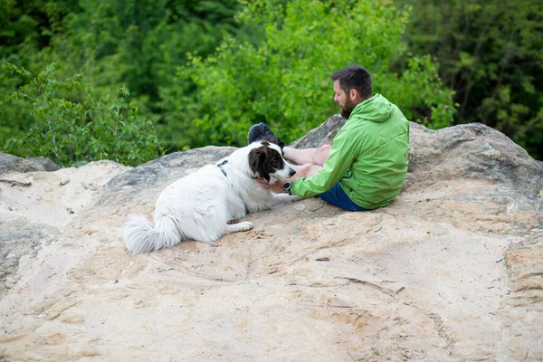 Man His Dog Sitting Rock Enjoying Nature — Stock Photo, Image