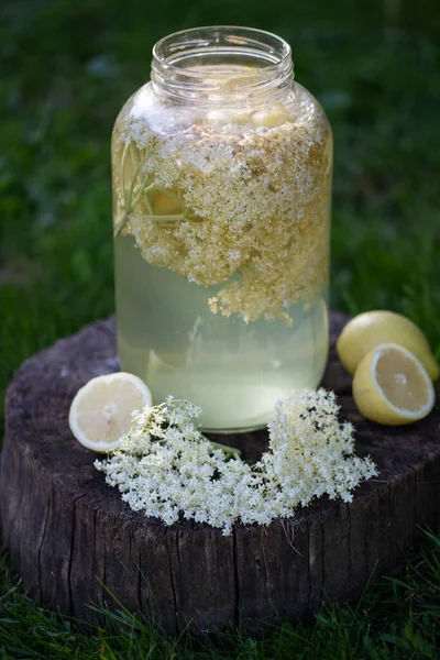 home made elderflower syrup with lemon in the glass