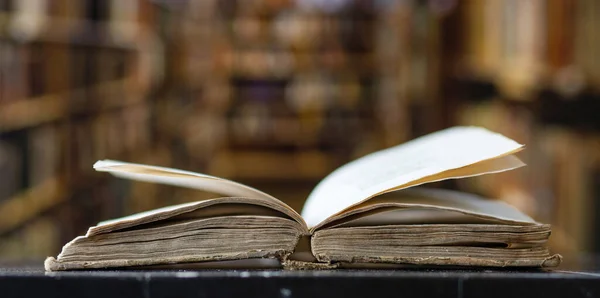 old open book in a library