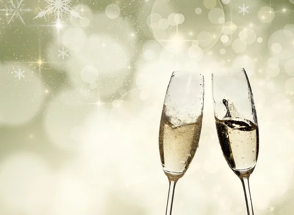 Toasting with champagne glasses on sparkling holiday background — Stock Photo, Image