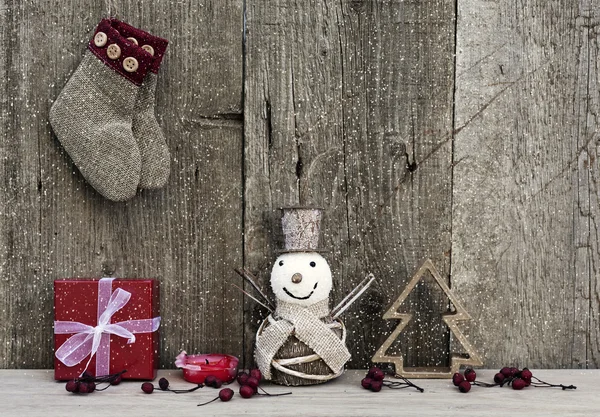 Christmas decorations on rustic wooden background — Stock Photo, Image