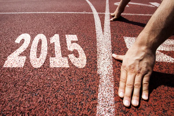 Happy new year 2015 - hands on starting line — Stock Photo, Image
