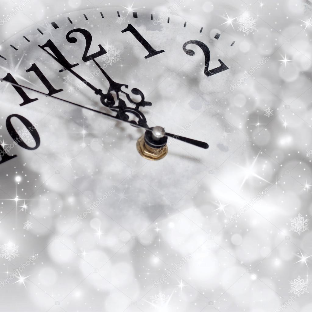 New Year's at midnight - old clock in snow 