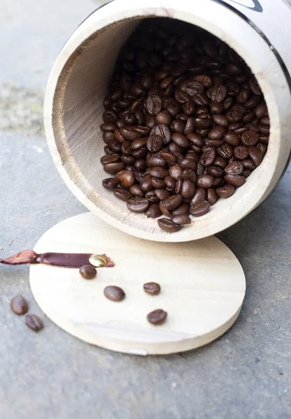 Coffee beans in wooden bowl — Stock Photo, Image