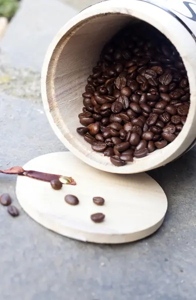 Coffee beans in wooden bowl — Stock Photo, Image
