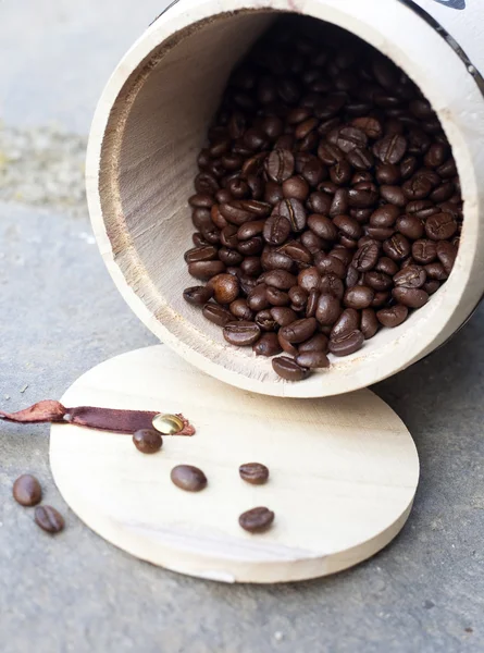 Coffee beans in wooden bowl — Stock Photo, Image