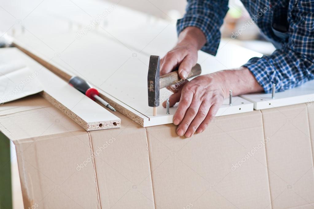 Man Assembling Flat Pack Furniture