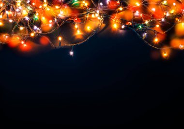 mavi arka plan üzerinde renkli Noel ışıkları