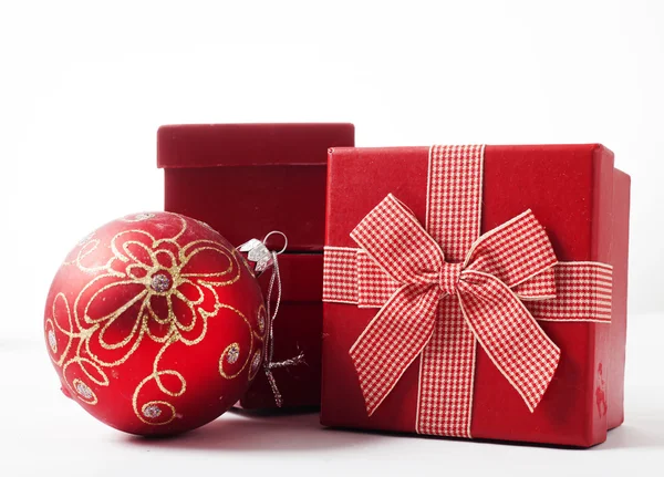 Red Christmas balls and gift boxes — Stock Photo, Image