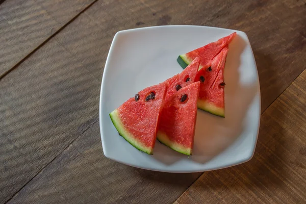 Watermelon on wood — Stock Photo, Image