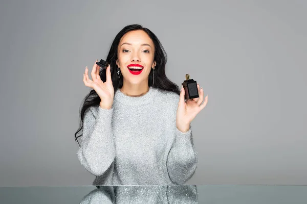 Excited Woman Red Lips Holding Bottle Perfume Isolated Grey — Stock Photo, Image