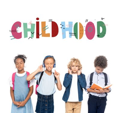 multicultural schoolkids listening music in wireless headphones near curly boy reading book and childhood lettering on white  clipart