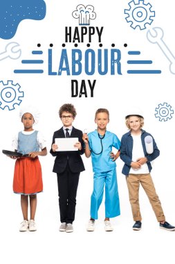 multicultural children in costumes of different professions near happy labour day lettering on white  clipart