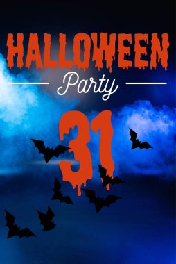 Halloween party lettering on blue background with smoke clipart