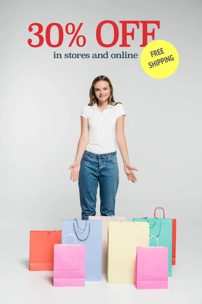 Young Joyful Woman Standing Pointing Hands Shopping Bags Free Shipping — Stock Photo, Image