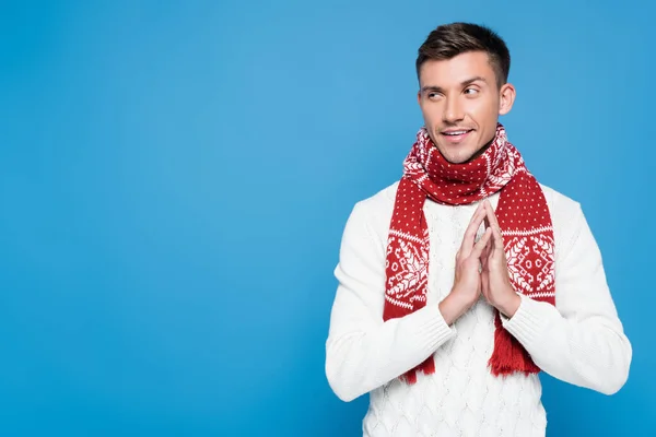 Cunning Young Adult Man Holding Palms Together Looking Away Isolated — Stock Photo, Image