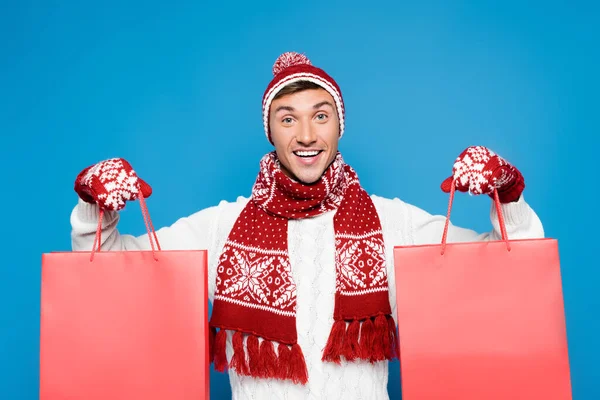 Front View Happy Man Warm Clothing Holding Red Paper Bags — Stock Photo, Image