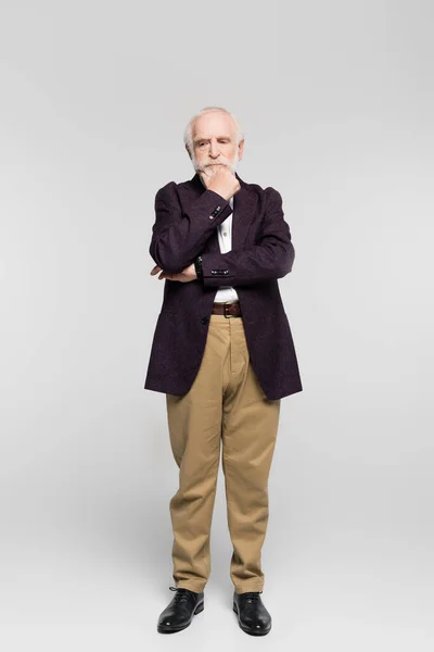 Pensive Senior Man Looking Away While Standing Grey Background — Stock fotografie