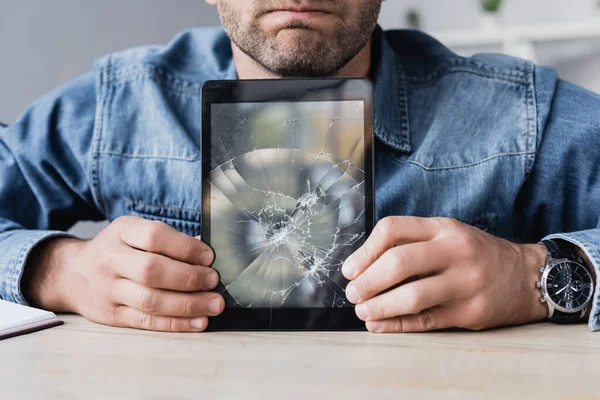 Cropped View Businessman Holding Smashed Digital Tablet Wooden Table — Stock Photo, Image