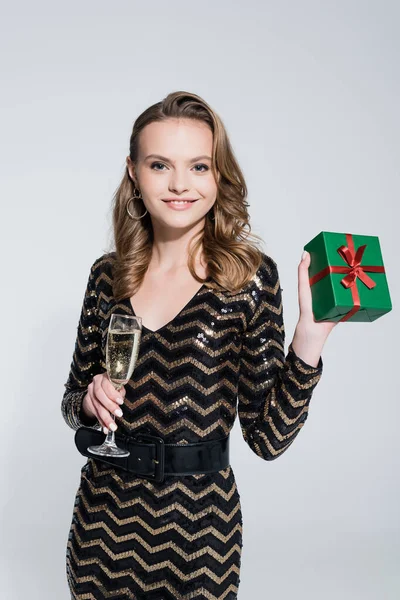 Happy Young Woman Holding Glass Champagne Wrapped Christmas Present Isolated — Stock Photo, Image