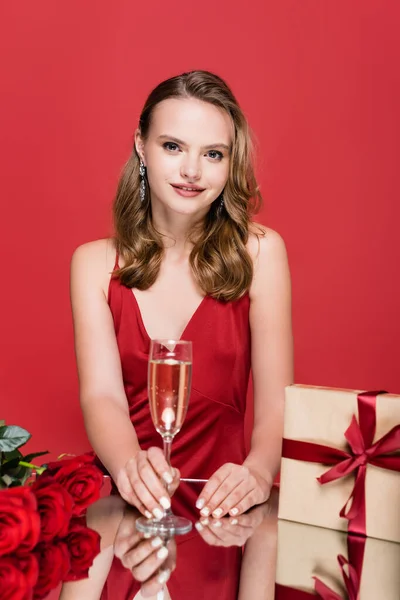 Joyful Woman Holding Glass Champagne Christmas Presents Roses Red — Stock Photo, Image