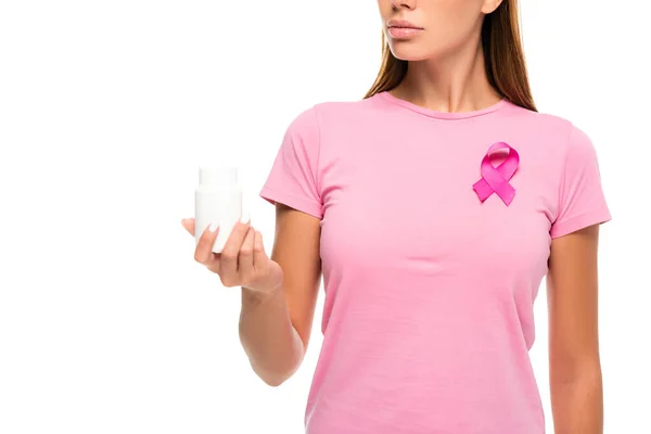 带乳腺癌意识带的妇女拿着装有白色隔离药丸的罐子的剪影 — 图库照片