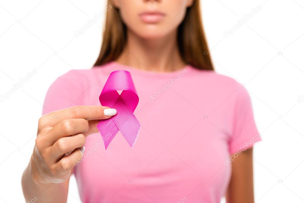 Cropped view of pink ribbon of breast cancer awareness in hand of woman on blurred background isolated on white